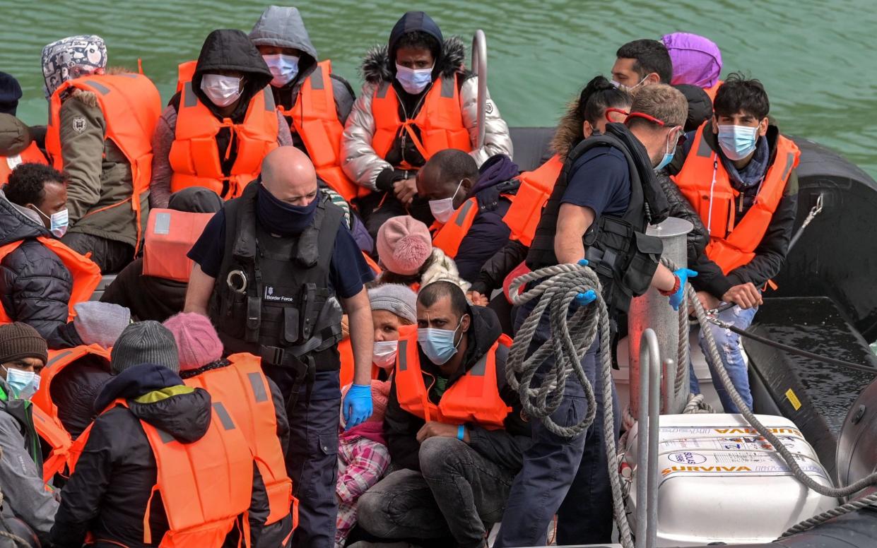People prepare to disembark at Dover Docks after British Border Force Officials picked up two boats carrying migrants in the English Channel - Stuart Brock/EPA-EFE/Shutterstock