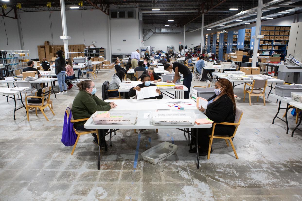 Election workers review absentee and provisional ballots in Georgia on November 6, 2020.