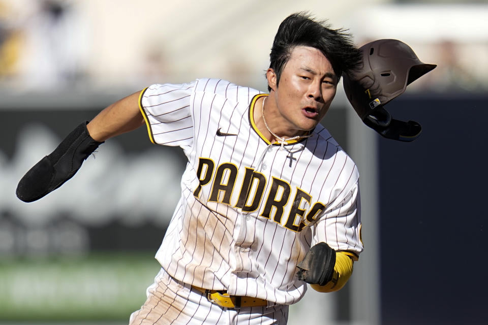 San Diego Padres' Ha-Seong Kim scores on a hit by Austin Nola during the fifth inning in Game 2 of the baseball NL Championship Series between the San Diego Padres and the Philadelphia Phillies on Wednesday, Oct. 19, 2022, in San Diego. (AP Photo/Gregory Bull)