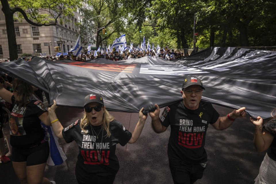 Participants march during the annual Israel Day Parade on Fifth Avenue on Sunday, June 2, 2024, in New York. (AP Photo/Yuki Iwamura)