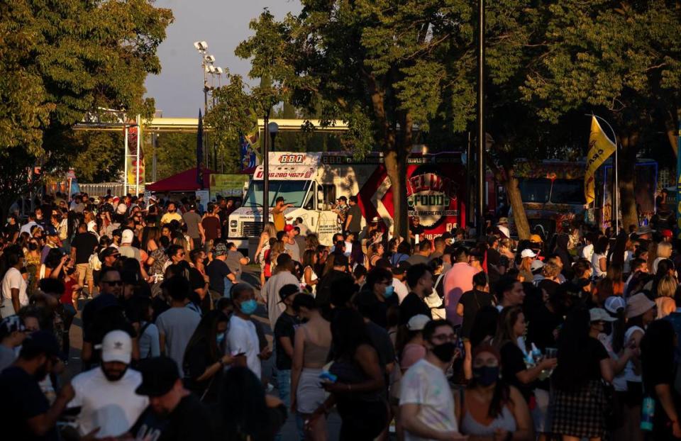 People attend the second of four nights at FoodieLand Night Market for an Asian inspired pop-up festival at Sacramento’s Cal Expo on Saturday, Sept. 4, 2021, featuring food trucks, local art, drinks and entertainment. Xavier Mascareñas/xmascarenas@sacbee.com