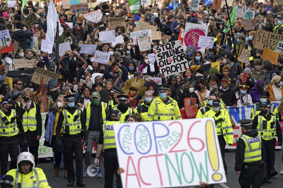 Climate activists march during a demonstration in the center of Glasgow, Scotland, Friday, Nov. 5, 2021, which is the host city of the COP26 U.N. Climate Summit. A protest is taking place as leaders and activists from around the world are gathering in Scotland's biggest city for the U.N. climate summit, to lay out their vision for addressing the common challenge of global warming. (Andrew Milligan/PA via AP)
