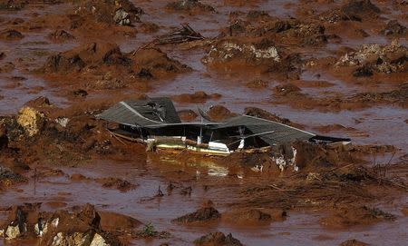 Debris of a house is pictured at Bento Rodrigues district, which was covered with mud after a dam owned by Vale SA and BHP Billiton Ltd burst in Mariana, Brazil, November 6, 2015. REUTERS/Ricardo Moraes/File Photo