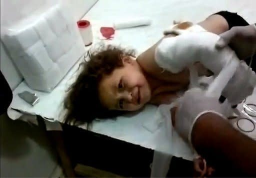 Image released by the Syrian opposition's Shaam News Network shows a wounded Syrian girl receiving medical care in Attibeh in Daraa province on June 7. AFP is using pictures from alternative sources as it was not authorised to cover this event and is not responsible for any alterations which cannot be independently verified