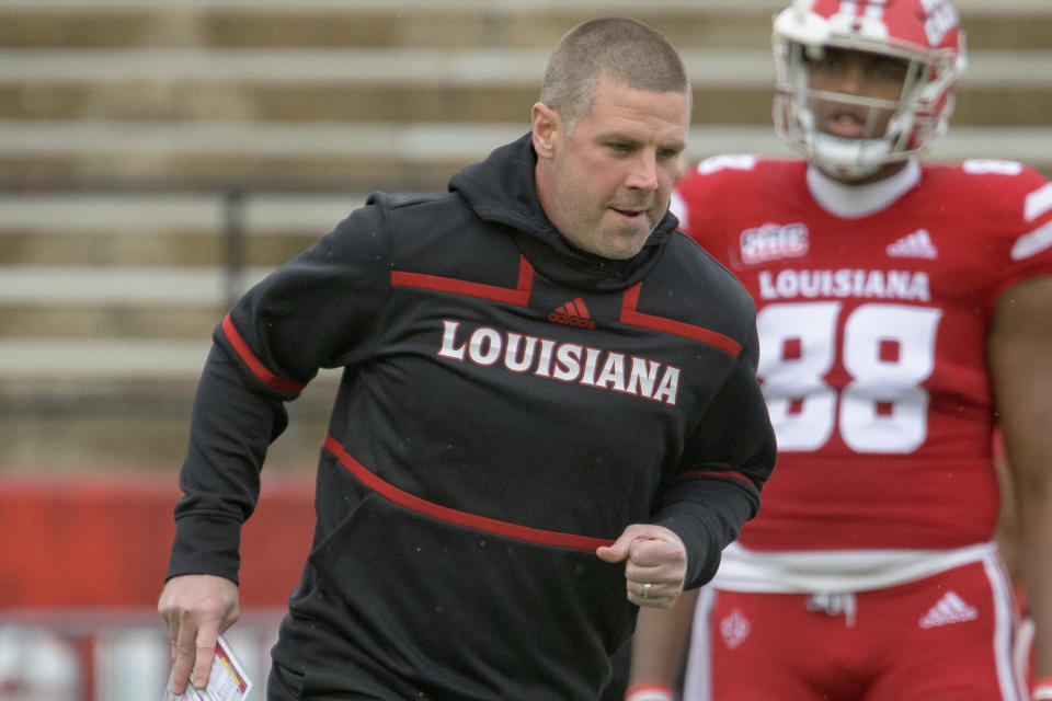 Louisiana-Lafayette head coach Billy Napier runs on the field before an NCAA college football game against Louisiana-Monroe in Lafayette, La., Saturday, Nov. 27, 2021. (AP Photo/Matthew Hinton)