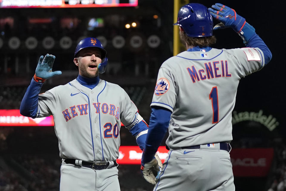 New York Mets' Pete Alonso (20) celebrates after hitting a two-run home run that scored Jeff McNeil (1) during the fifth inning of the team's baseball game against the San Francisco Giants in San Francisco, Friday, April 21, 2023. (AP Photo/Jeff Chiu)