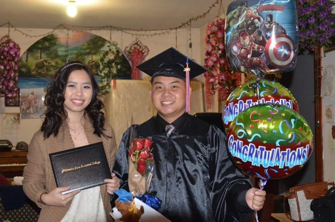 Officer Kou Her is seen after graduating from Milwaukee Area Technical College with his niece Megan Yaj. Her was the first in his family to graduate from college, Yaj said.