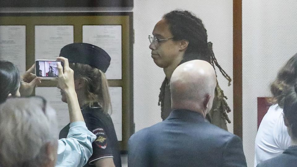 Phoenix Mercury Brittney Griner (C) is escorted to a courtroom for a hearing, in Khimki City Court, outside Moscow, Russia, 14 July 2022.
