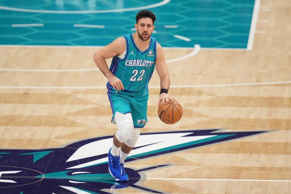 Feb 10, 2024; Charlotte, North Carolina, USA; Charlotte Hornets guard Vasilije Micic (22) brings the ball up court during the second quarter against the Memphis Grizzlies at Spectrum Center. Jim Dedmon/USA TODAY Sports