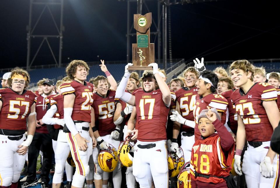 The New Bremen Cardinals celebrate their state championship win over Warren JFK in the OHSAA Division VII state finals at Tom Benson Hall of Fame Stadium. Saturday, Dec. 3, 2022.