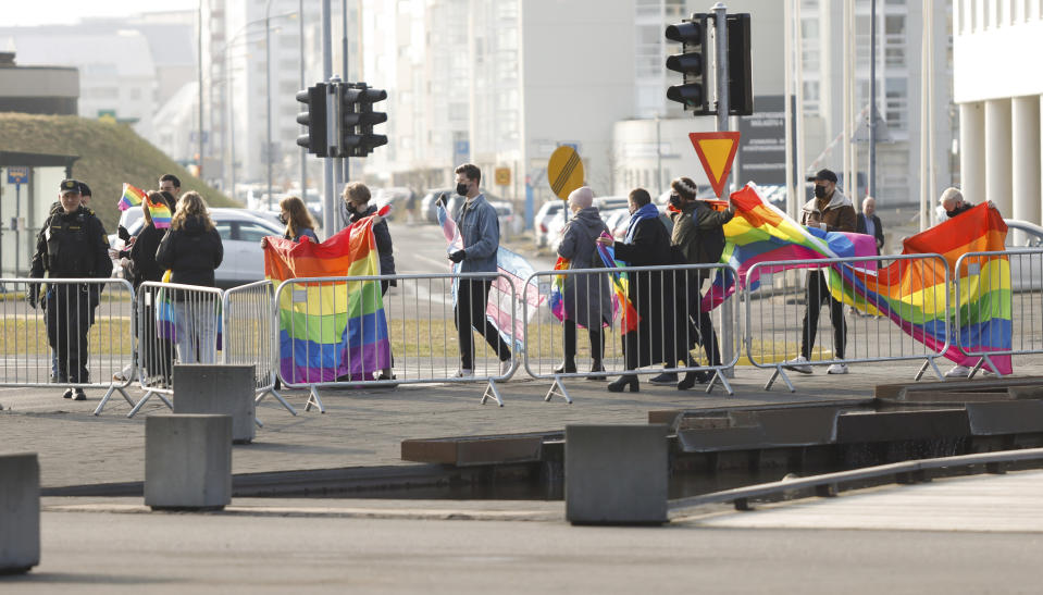 Protestors gather outside the conference hall where the Arctic Council Ministerial Meeting takes place in Reykjavik, Iceland, Thursday, May 20, 2021. (AP Photo/Brynjar Gunnarsson, Pool)