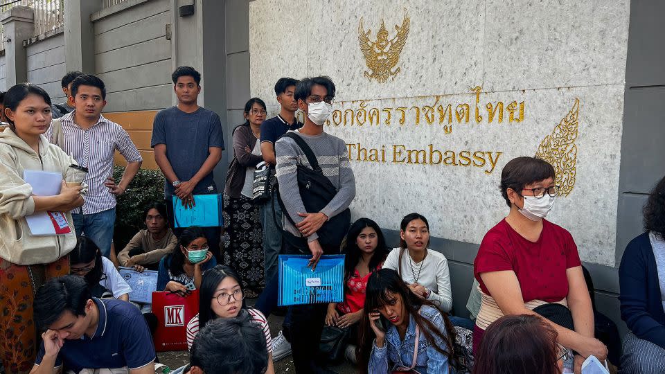 People stand in line for visas at the Thai Embassy in Yangon on February 16, 2024, after Myanmar's military government said it would impose military service. - AFP/Getty Images
