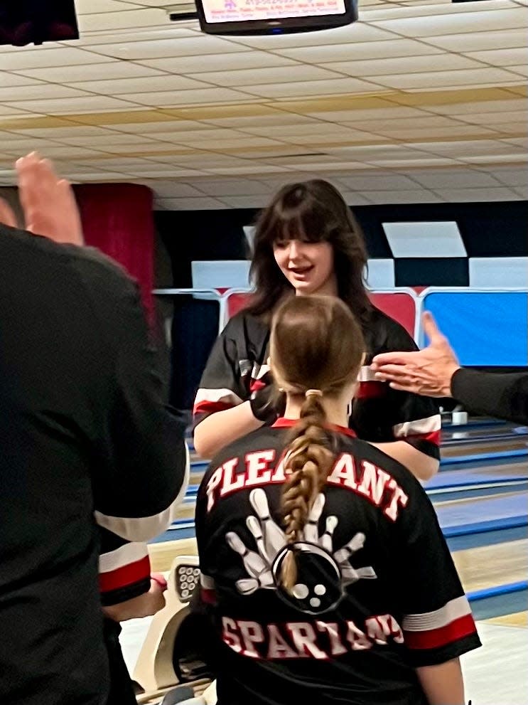 Pleasant's Kenzie Childers reacts to a shot she made during the Mid Ohio Athletic Conference Girls Bowling Tournament at Galion's Vicotry Lanes on Saturday night.