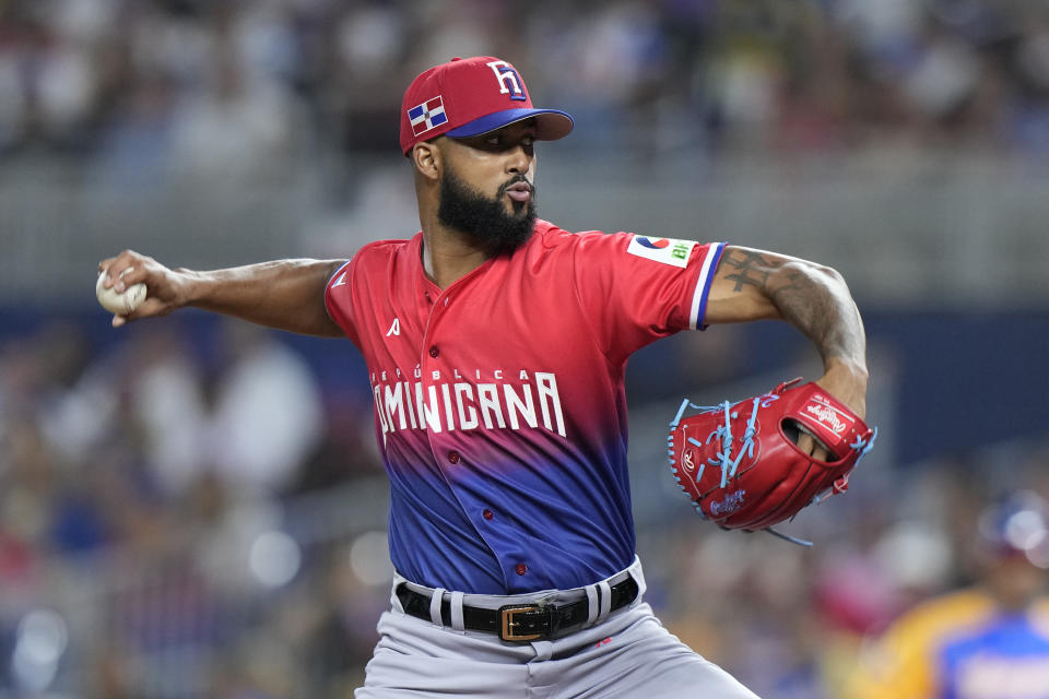 Dominican Republic's Sandy Alcantara delivers a pitch during the first inning of a World Baseball Classic game against Venezuela, Saturday, March 11, 2023, in Miami. (AP Photo/Wilfredo Lee)