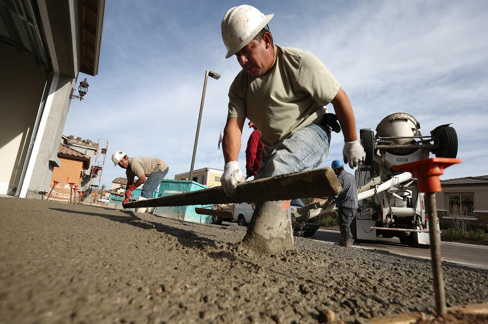 PHOENIX, AZ - MARCH 05:  Workers pour concrete for a driveway of a new home at the Pulte Homes Fireside at Norterra-Skyline housing development on March 5, 2013 in Phoenix, Arizona. In 2008, Phoenix, Arizona was at the forefront of the U.S. housing crisis with home prices falling 55 percent between 2005 and 2011 leaving many developers to abandon development projects. Phoenix is now undergoing a housing boom as sale prices have surged 22.9 percent, the highest price increase in the nation, and homebuilders are scrambling to buy up land.  (Photo by Justin Sullivan/Getty Images)