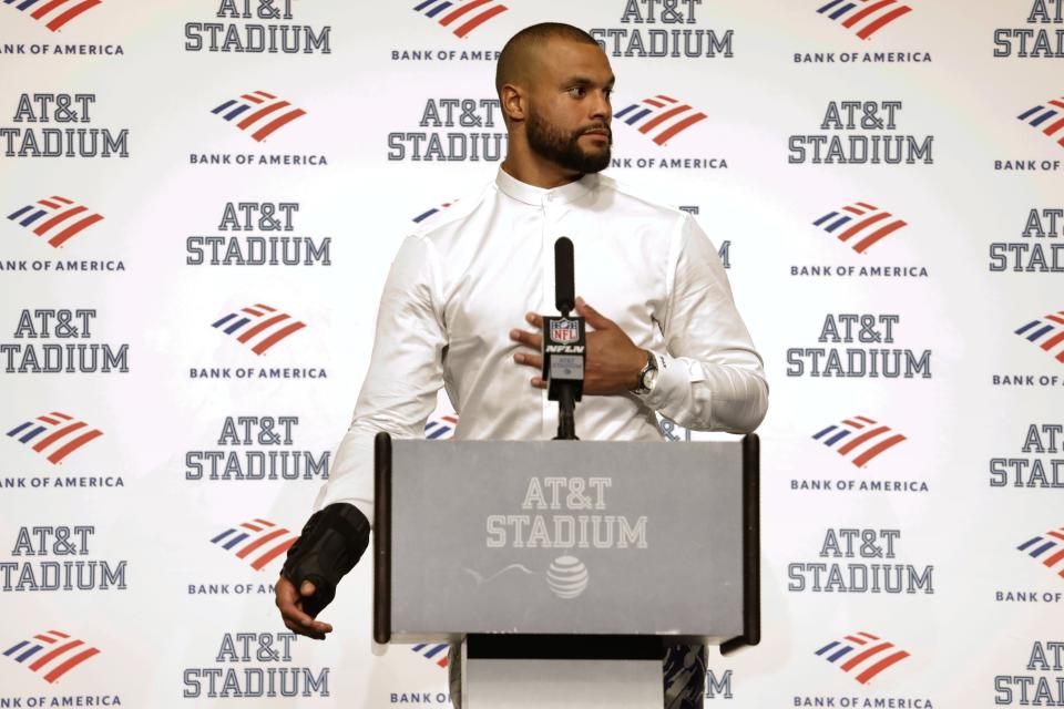 Dallas Cowboys quarterback Dak Prescott, wearing a brace on his right hand, responds to questions during a post game news conference following the team's 19-3 loss to the Tampa Bay Buccaneers in a NFL football game in Arlington, Texas, Sunday, Sept. 11, 2022. (AP Photo/Ron Jenkins)