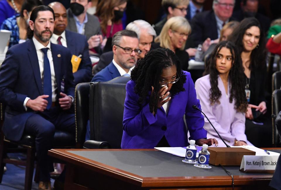 Judge Ketanji Brown Jackson wipes away tears before being sworn in during her nomination hearing to be an associated justice on the US Supreme Court in Washington, DC on March 21, 2022.