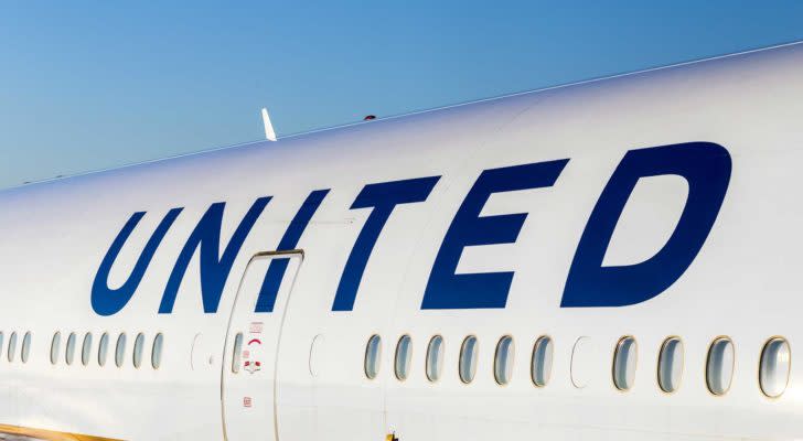 The side of a United Airlines (UAL) plane with &quot;united&quot; written above passenger windows. Represents airline stocks.