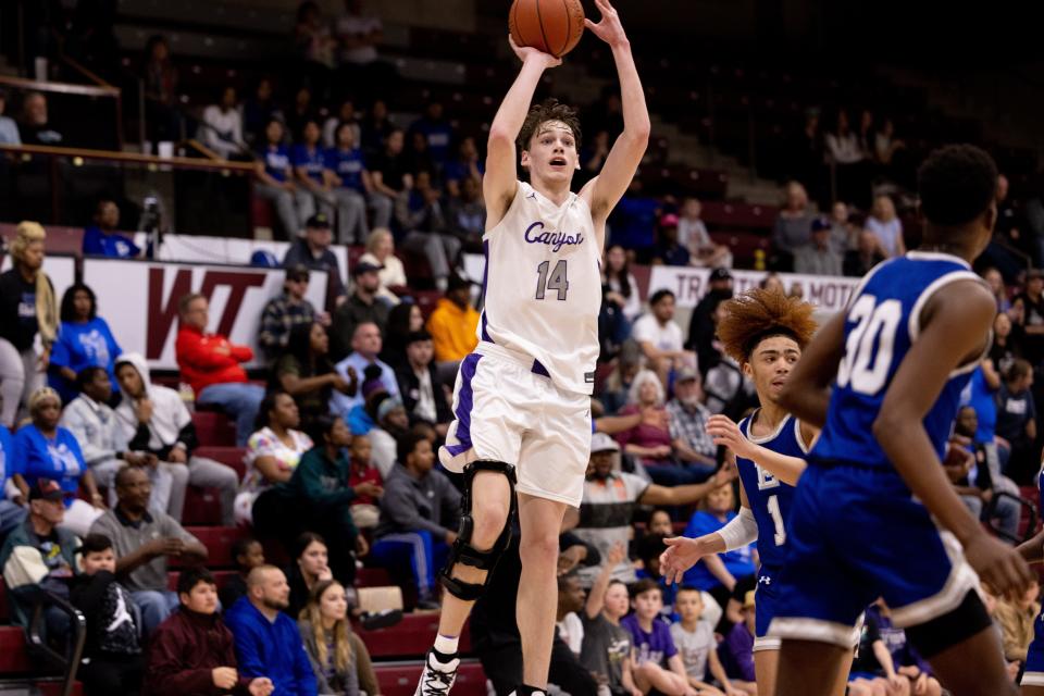 Canyon’s Kemper Jones (14) attempting a three-pointer during a Regional Quarterfinal game Tuesday March 1st, Estacado at Canyon in Canyon, TX. Trevor Fleeman/For Amarillo Globe-News.