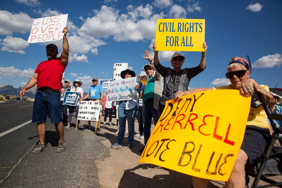 Community members protest a rally for former Rep. Yvette Herrell on Monday, April 10, 2023, at New Mexico Farm and Ranch Heritage Museum. 