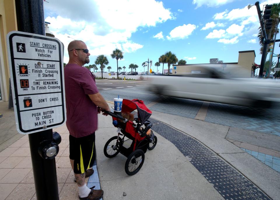 A pedestrian looks to cross State Road A1A in Daytona Beach, the metro area named the nation's worst for the safety of people walking.