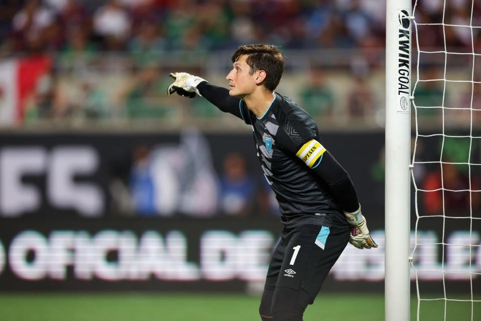 Apr 27, 2022; Orlando, FL, USA; Guatemala goalkeeper Nicholas Hagen (1) directs his team prior to a free kick attempt during a match against Mexico at Camping World Stadium. Mandatory Credit: Nathan Ray Seebeck-USA TODAY Sports