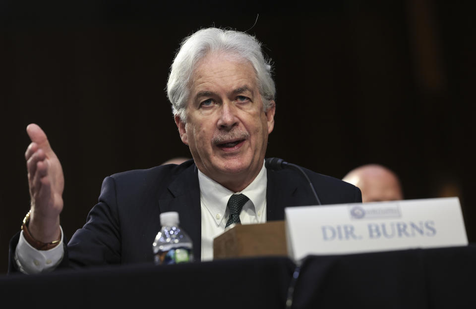 CIA Director William Burns, seated at a desk in a hearing, addresses the Senate Intelligence Committee.