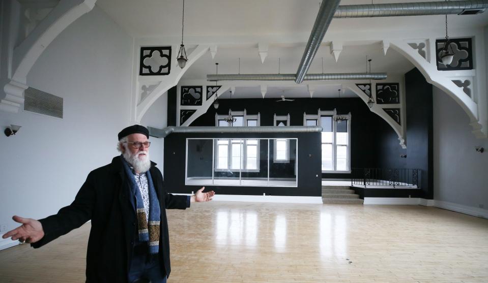 Akron developer Tony Troppe tours Castle Hall in 2021 as he talks about his plan to densify the area. He received an Ohio Historic Tax Credit this month to help him pay for the project.