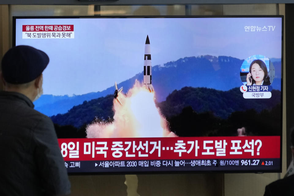 A TV screen shows a file image of North Korea's missile launch during a news program at the Seoul Railway Station in Seoul, South Korea, Wednesday, Nov. 2, 2022. South Korea says it has issued an air raid alert for residents on an island off its eastern coast after North Korea fired a few missiles toward the sea. (AP Photo/Ahn Young-joon)