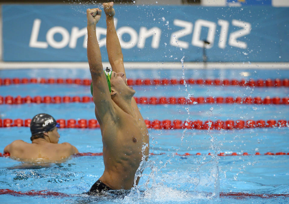 South Africa's Chad le Clos celebrates winning gold in the men's 200-meter butterfly swimming final at the Aquatics Centre in the Olympic Park during the 2012 Summer Olympics in London, Tuesday, July 31, 2012. (AP Photo/Mark J. Terrill)