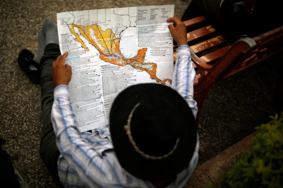 <p>A man who is part of a caravan of migrants from El Salvador en route to the United States rests at the Central Park in Tecun Uman, Guatemala, on Nov. 1, 2018. (Photo: Jose Cabezas/Reuters) </p>