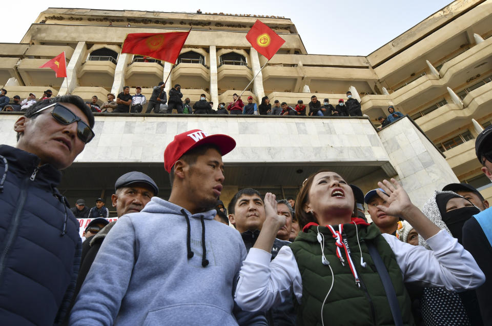 Supporters of Kyrgyzstan's Prime Minister Sadyr Japarov attend a rally in Bishkek, Kyrgyzstan, Thursday, Oct. 15, 2020. Kyrgyzstan President Sooronbai Jeenbekov announced his resignation on Thursday in a bid to end the turmoil that has engulfed the Central Asian nation after a disputed parliamentary election. (AP Photo/Vladimir Voronin)