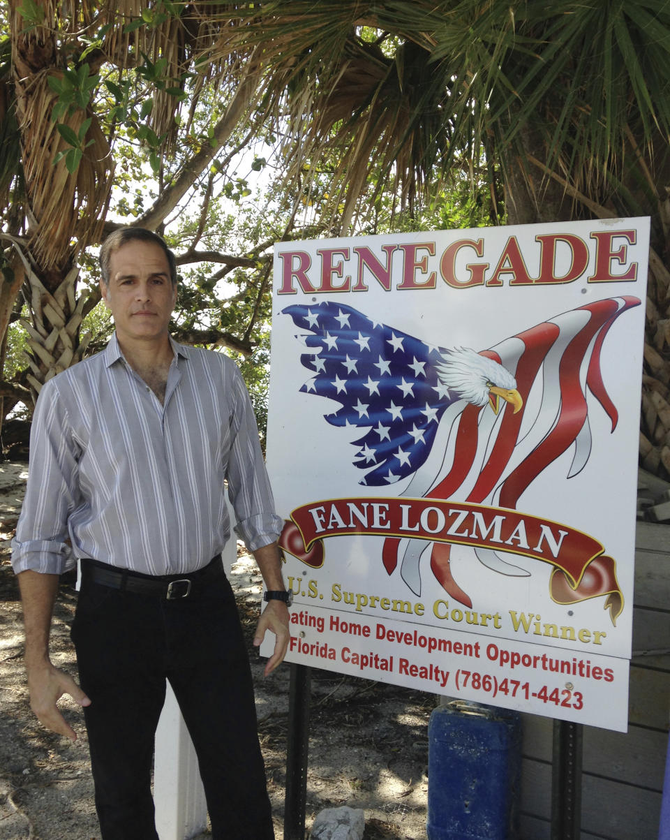 In this Feb. 24, 2017 photo, Fane Lozman stands on his property in Riviera Beach, Fla. Lozman beat long odds just getting his case to the U.S. Supreme Court, which agreed four years ago that his floating home was a house and wasn’t a vessel subject to seizure by a Florida city that destroyed it. Now Lozman is asking the nation’s highest court to welcome the case back into its port anew and order the city to reimburse him the estimated $165,000 value of the home, plus legal fees. (AP Photo/Curt Anderson)