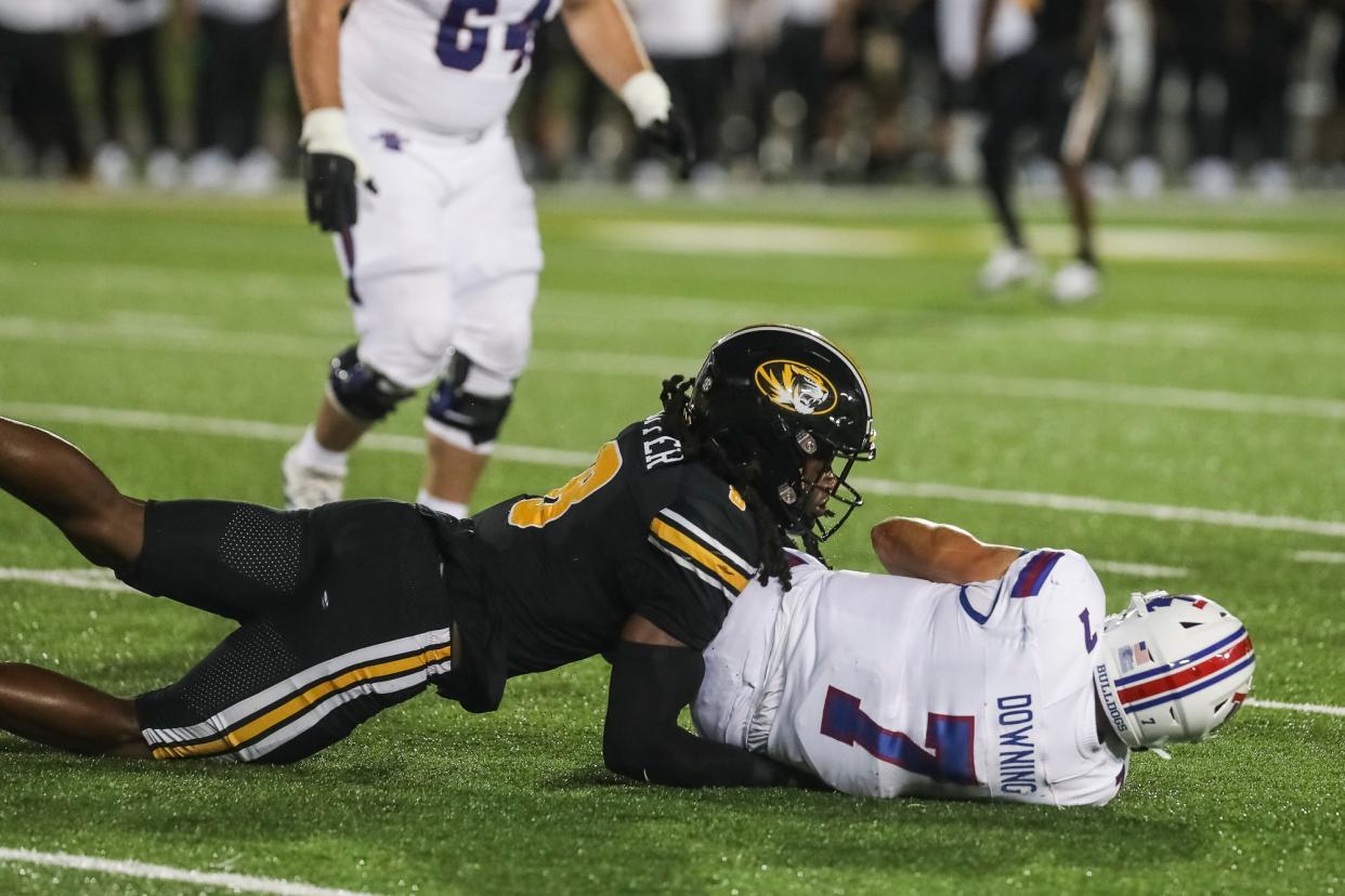 Missouri linebacker Ty'Ron Hopper (8) sacks Louisiana Tech quarterback Matthew Downing (7) on Thursday, Sept. 1, 2022, at Faurot Field.