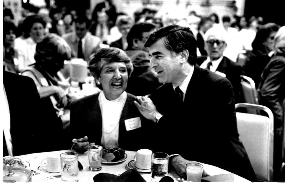 Massachusetts Gov. Michael Dukakis, vaulted into prominence by Gary Hart’s withdrawal from the presidential race, talks with Sacramento Mayor Anne Rudin at Wednesday at the Harry S. Truman breakfast club at the Capitol Plaza Inn in Sacramento in May 1987. Dukakis was on a tour of the west asking for support for the Democratic nomination.