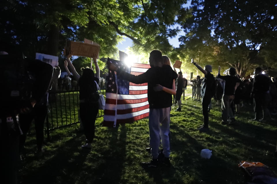 Demonstrators gather to protest the death of George Floyd, Sunday, May 31, 2020, near the White House in Washington. Floyd died after being restrained by Minneapolis police officers (AP Photo/Alex Brandon)