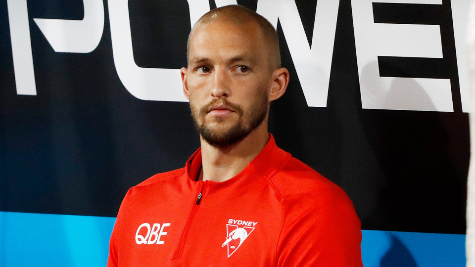 Sydney Swans' Sam Reid (pictured) sits on the bench during an AFL game.