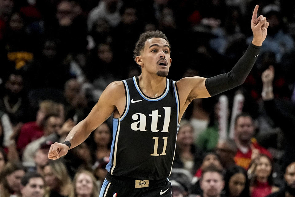 Atlanta Hawks guard Trae Young (11) celebrates a basket against the Miami Heat during the second half of an NBA basketball game, Saturday, Nov. 11, 2023, in Atlanta. The Miami Heat won 117-109. (AP Photo/Mike Stewart)