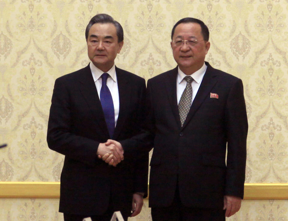 FILE - In this May 2, 2018, file photo, North Korean Foreign Minister Ri Yong Ho, right, poses with his Chinese counterpart Wang Yi at the Mansudae Assembly Hall in Pyongyang, North Korea. North Korea is sending its foreign minister to key ally China for talks amid a stall in efforts to persuade Pyongyang to dismantle its nuclear programs. Ri was due to arrive late Thursday, Dec. 6, 2018 and meet Friday, Dec. 7 with Wang. (AP Photo/Jon Chol Jin, File)