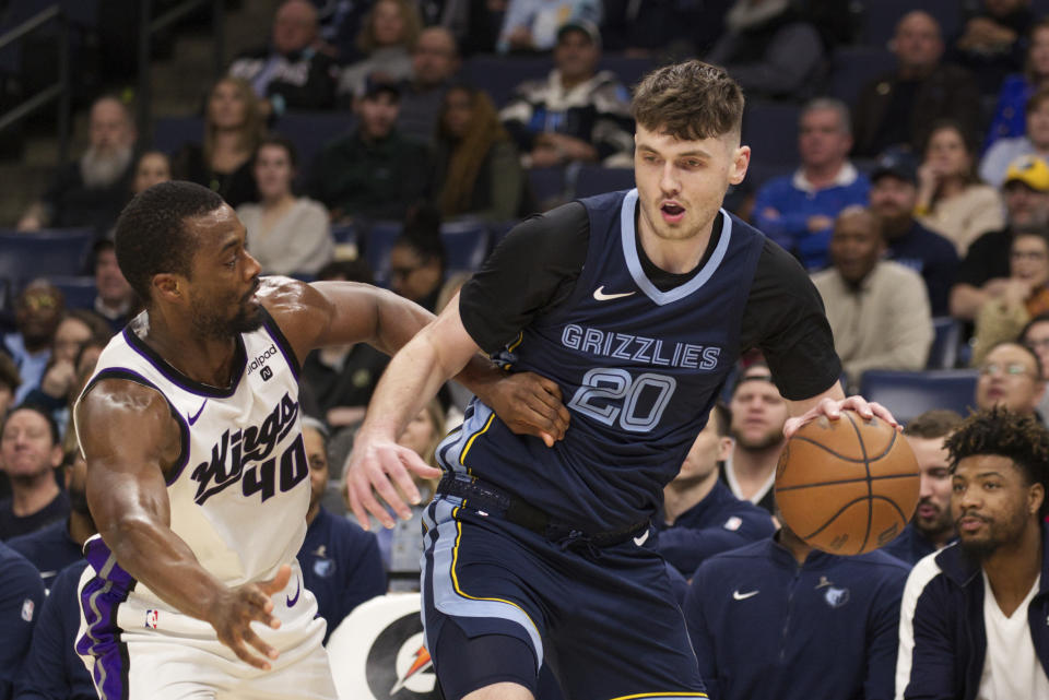 Sacramento Kings forward Harrison Barnes (40) defends against Memphis Grizzlies forward Matthew Hurt, right, in the first half of an NBA basketball game Monday, Jan. 29, 2024, in Memphis, Tenn. (AP Photo/Nikki Boertman)