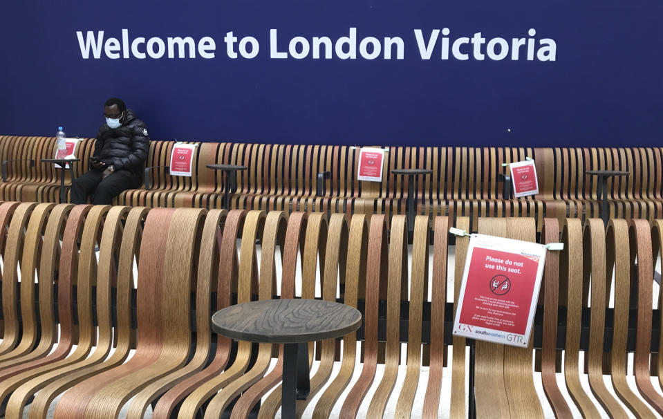 Seats displaying social distancing signs at Victoria Station, London, Monday, May 11, 2020, as the country continues in lockdown to help stop the spread of coronavirus. Britain's Prime Minister Boris Johnson announced Sunday that people could return to work if they could not work from home. (AP Photo/Kirsty Wigglesworth)