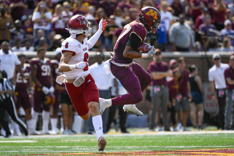 Minnesota defensive back Tyler Nubin, right, intercepts a pass intended for Miami-Ohio wide receiver Austin Robinson during the second half of an NCAA college football game on Saturday, Sept. 11, 2021, in Minneapolis. Minnesota won 31-26. (AP Photo/Craig Lassig)