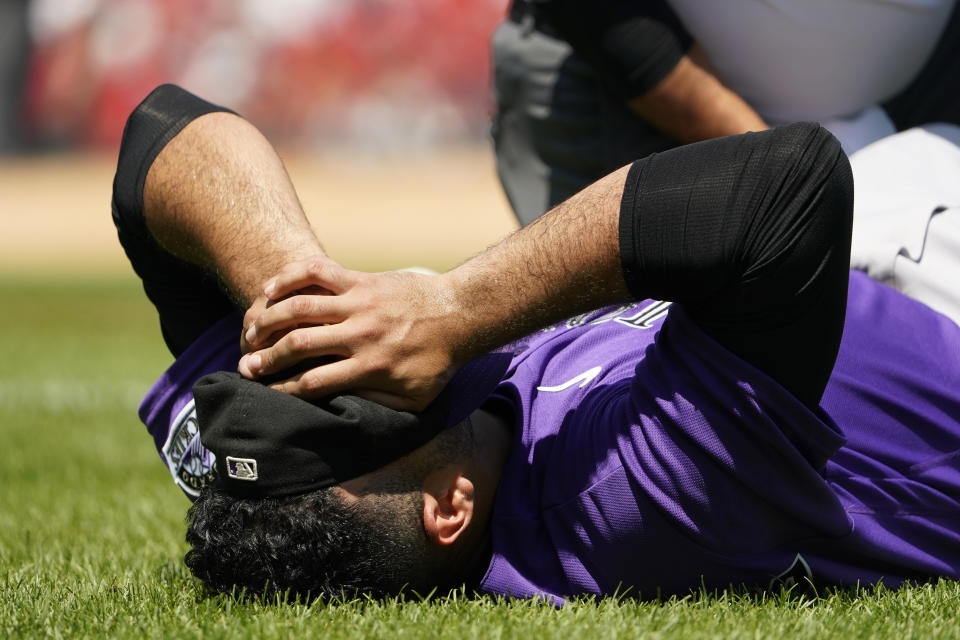Colorado Rockies starting pitcher Antonio Senzatela reacts after being injured while covering first base during the second inning of a baseball game against the St. Louis Cardinals Thursday, Aug. 18, 2022, in St. Louis. Senzatela left the game. (AP Photo/Jeff Roberson)