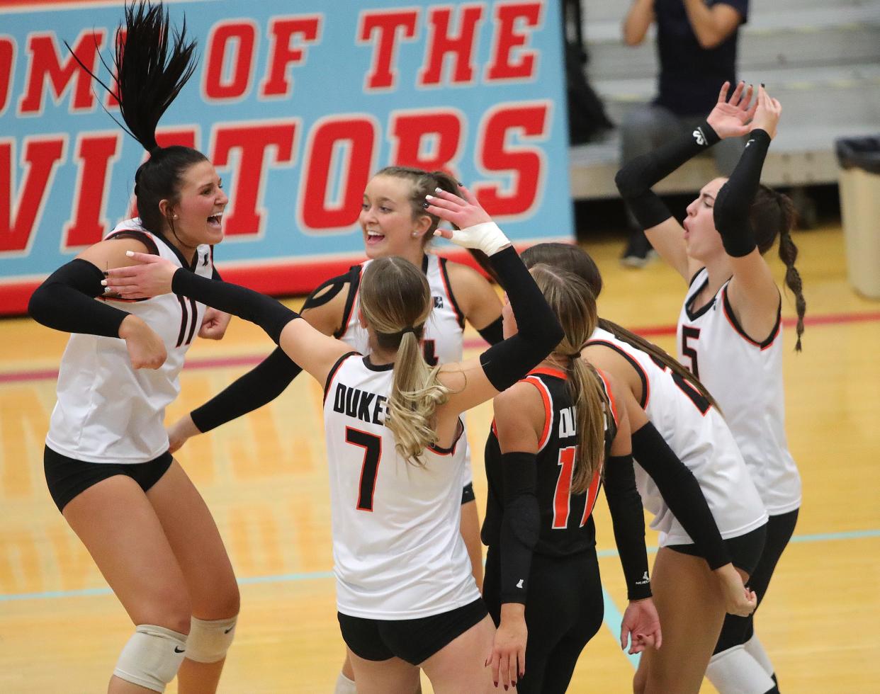 The Marlington volleyball team celebrates during the fifth set of a five-set win over Kenston in a regional semifinal, Thursday, Nov. 2, 2023.