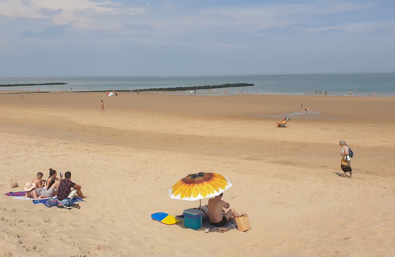 People sunbathe on a beach during the coronavirus disease (COVID-19) outbreak, in Knokke-Heist