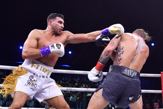 Tommy Fury, left, aims a punch at Jake Paul