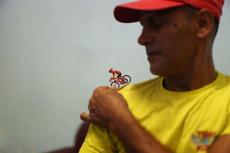 Felix Guirola, 52, plays with miniature bike at his home in Havana, Cuba, July 20, 2016. REUTERS/Alexandre Meneghini . REUTERS/Alexandre Meneghini SEARCH "FELIX GUIROLA" FOR THIS STORY. SEARCH "WIDER IMAGE" FOR ALL STORIES.