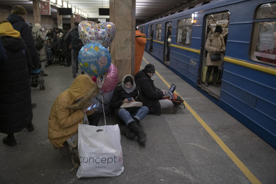 People rest in the subway station being used as a bomb shelter during a rocket attack in Kyiv, Ukraine, Monday, Dec. 5, 2022. Ukraine’s air force said it shot down more than 60 of about 70 missiles that Russia fired on in its latest barrage against Ukraine. It was the latest onslaught as part of Moscow’s new, stepped-up campaign that has largely targeted Ukrainian infrastructure and disrupted supplies of power, water and heat in the country as winter looms. (AP Photo/Andrew Kravchenko)