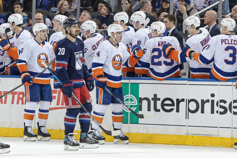 Mar 17, 2024; New York, New York, USA; New York Islanders center Bo Horvat (14) celebrates his goal with teammates during the second period against the New York Rangers at Madison Square Garden. Mandatory Credit: Vincent Carchietta-USA TODAY Sports