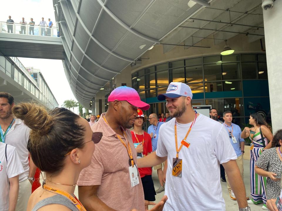 Former NFL star Michael Strahan (left) and Buffalo Bills QB Josh Allen (right) chat close to the Miami Grand Prix hospitality area ahead of Sunday's Miami Grand Prix.